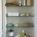 assorted hair accessories in a medicine cabinet