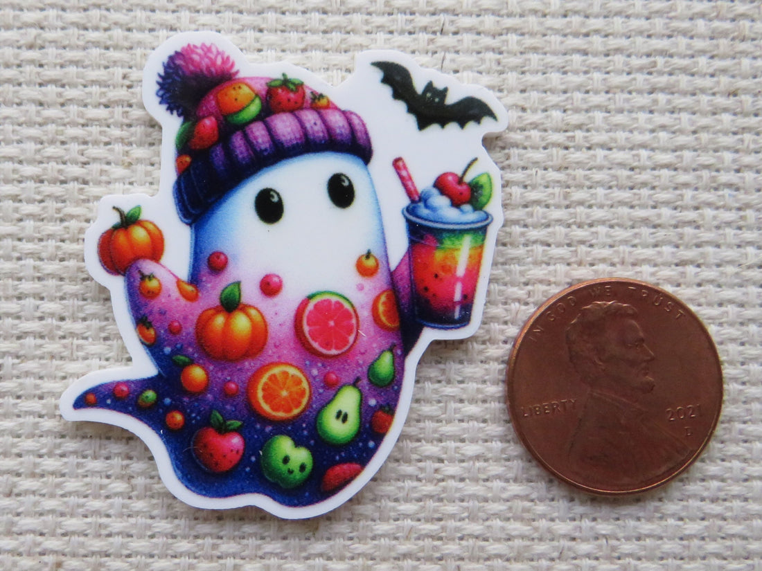 First view of White and purple ghost with fruit slices, a pumpkin, tomato, apple, an avocado...just to name a few and he is holding a cool looking drink minder.