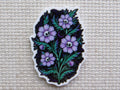 First view of Spooky purple flowers with skulls as their center minder.