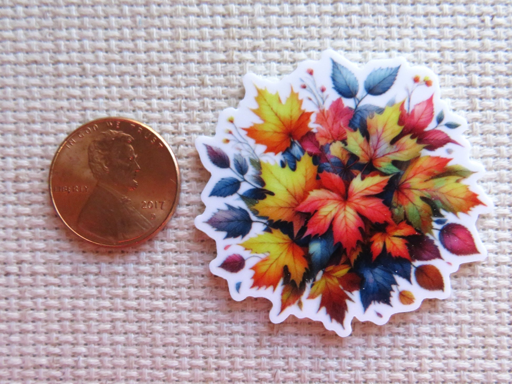 Second view of view of A Burst of Fall Colors Needle Minder, multicolored fall leaves in a bunch.