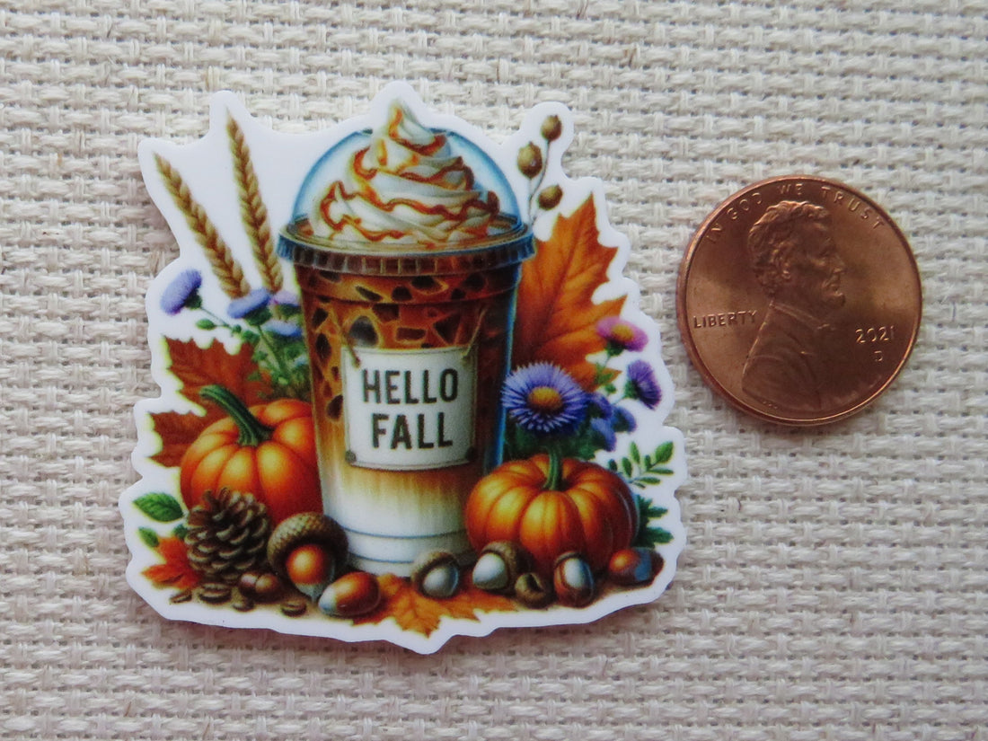 First view of Yummy looking pumpkin flavored drink with pumpkins, acorns, a pinecone, fall leaves and flowers surrounding it minder.