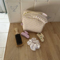 assorted hair accessories and linen pouch on counter
