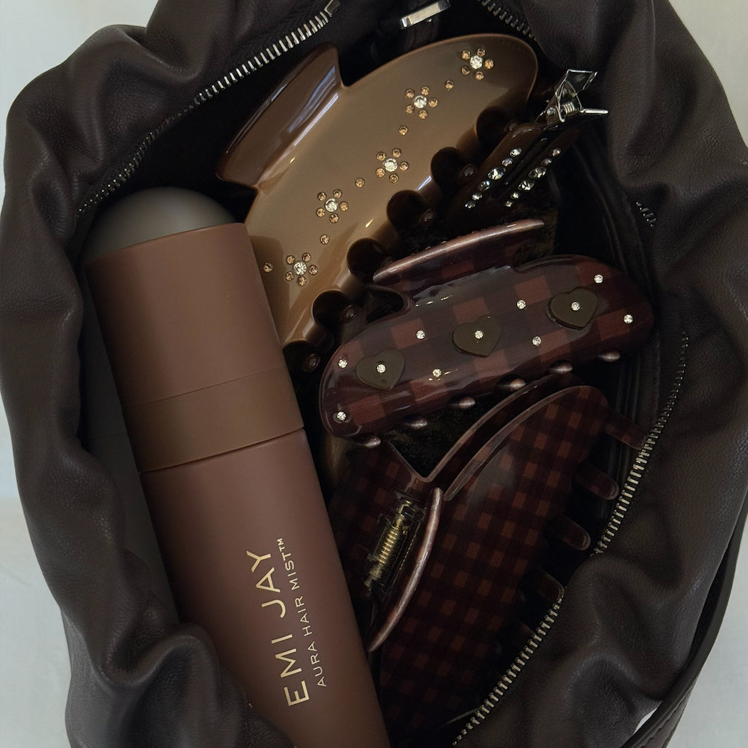 Purse with Aura Hair Mist and assorted Emi Jay Hair Clips.